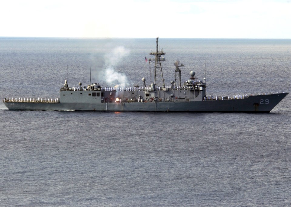 US Navy 061116-N-3285B-045 Sailors aboard the Oliver Hazard Perry-class frigate USS Stephen W. Groves (FFG 29) man the rails as the ship fires a gun salute in a re-enactment of the salute given to USS Andrew Doria