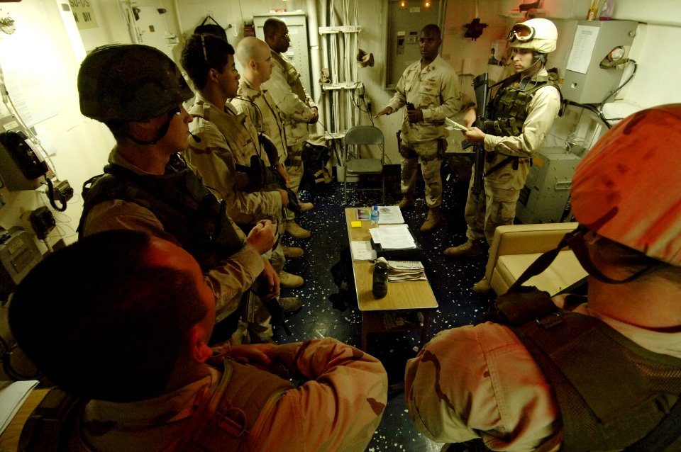 US Navy 061116-N-8148A-256 U.S. Navy Chief Master-at Arms Cephia Batson, from Mobile Security Squadron Three, gives his security watch standers a safety brief prior to the start of their assigned watches