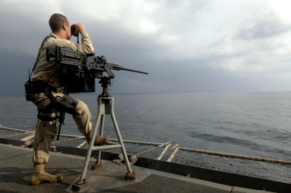US Navy 061117-N-8148A-018 U.S. Navy Master at Arms Seaman Apprentice Jon Moore, from Mobile Security Squadron Three, scans the ocean during his security watch aboard the Military Sealift Command (MSC) fast combat support ship