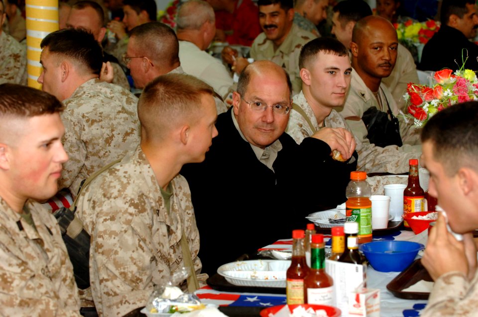 US Navy 061123-N-3642E-008 Secretary of the Navy (SECNAV) The Honorable Dr. Donald C. Winter eats Thanksgiving lunch with Marines and Sailors stationed at Camp Fallujah