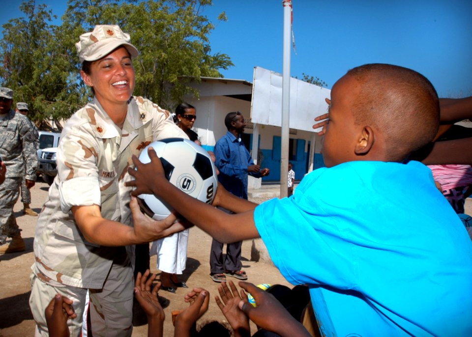US Navy 061119-N-1328C-455 U.S. Navy Lt. Cmdr. Wendy Halsey assigned to Combined Joint Task Force - Horn of Africa (JTF-HOA) hands out soccer balls to students in Balbala, Djibouti