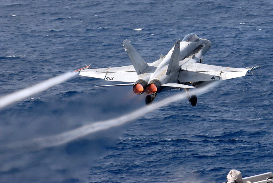US Navy 061114-N-0684R-058 An F-A-18C Hornet from the Argonauts of Strike Fighter Squadron One Four Seven (VFA-147) launches off the flight deck of the nuclear-powered aircraft carrier USS John C. Stennis (CVN 74)