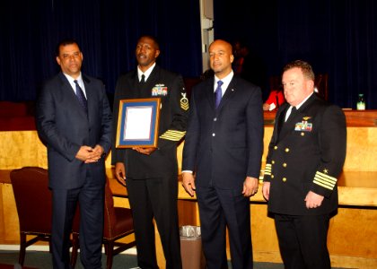 US Navy 061117-N-7427G-001 Senior Chief Master-at-Arms Reginald Madison is presented with the Mayor's Council of Military Affairs of Greater New Orleans Appreciation Award for exemplary civic service