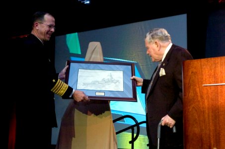 US Navy 061127-N-0696M-241 Chief of Naval Operations (CNO) Adm. Mike Mullen presents retired Rear Adm. Wayne E. Meyer with a picture of the ship that will bear his name at a ceremony celebrating the deliverance of the 100th Aeg photo