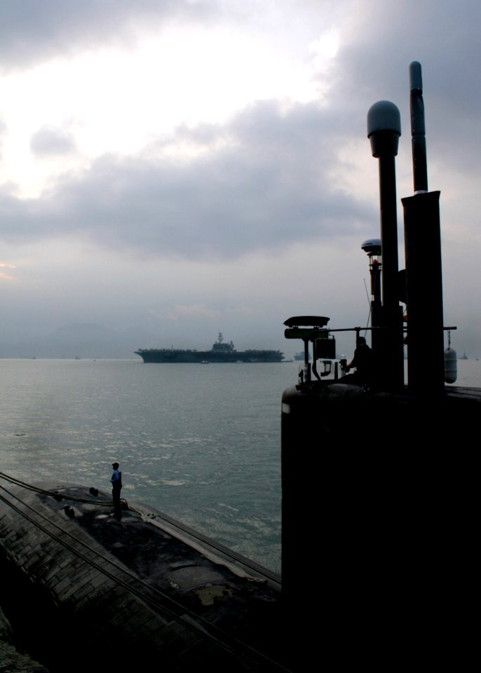 US Navy 061128-N-4953E-005 Los Angeles-class fast attack submarine USS Asheville (SSN 758) is moored with guided-missile destroyer USS Stethem (DDG 63) while anchored in Victoria Harbor for a port visit to Hong Kong after compl