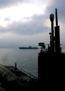 US Navy 061128-N-4953E-005 Los Angeles-class fast attack submarine USS Asheville (SSN 758) is moored with guided-missile destroyer USS Stethem (DDG 63) while anchored in Victoria Harbor for a port visit to Hong Kong after compl