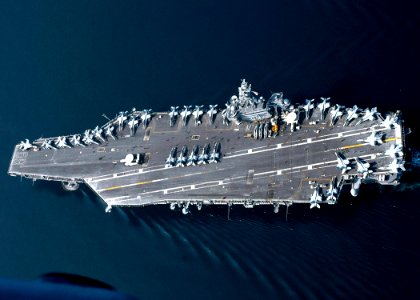 US Navy 061120-N-8547M-309 The Nimitz-class aircraft carrier USS Dwight D. Eisenhower (CVN 69), transit in formation with USS Anzio (CG 68) and USS Saipan (LHA 2) during a photographic exercise,
