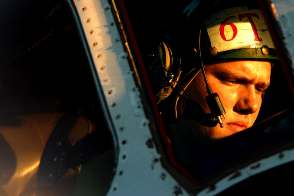 US Navy 061116-N-4776G-405 Aviation Electronics Technician 3rd Class Leon Threkel runs a daily maintenance check on an E-2C Hawkeye on the flight deck of USS Ronald Reagan (CVN 76)