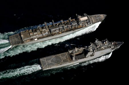 US Navy 061122-N-8148A-158 The Military Sealift Command (MSC) fast combat support ship USNS Supply (T-AOE 6), left, conducts an underway replenishment (UNREP) with the dock landing ship USS Comstock (LSD 45)