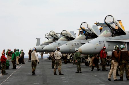 US Navy 061201-N-6106R-007 Pilots prepare to climb into their cockpits to perform final checks on their aircraft before flight operations aboard USS Kitty Hawk (CV 63)