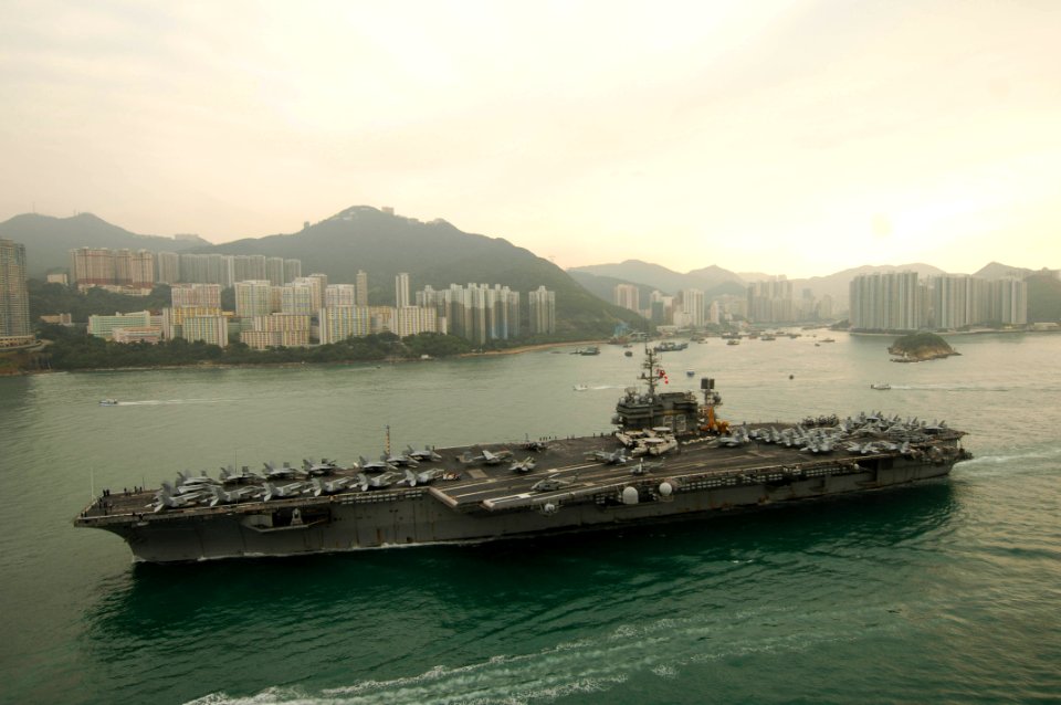 US Navy 061123-N-8591H-072 USS Kitty Hawk (CV 63) steams into Victoria Harbor for a port visit to Hong Kong after completing Annual Exercise 2006