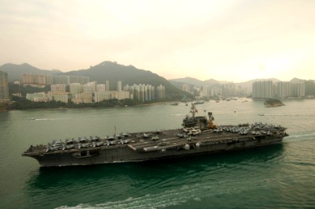 US Navy 061123-N-8591H-072 USS Kitty Hawk (CV 63) steams into Victoria Harbor for a port visit to Hong Kong after completing Annual Exercise 2006
