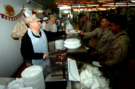 US Navy 061123-N-3642E-003 Secretary of the Navy (SECNAV) The Honorable Dr. Donald C. Winter serves Thanksgiving lunch to Marines and Sailors stationed at Camp Fallujah