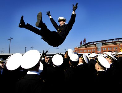 US Navy 061202-F-0193C-006 U.S. Navy Midshipman Stan Jett is thrown into the air during pre-game activities at the Army-Navy football game at Lincoln Financial Field in Philadelphia