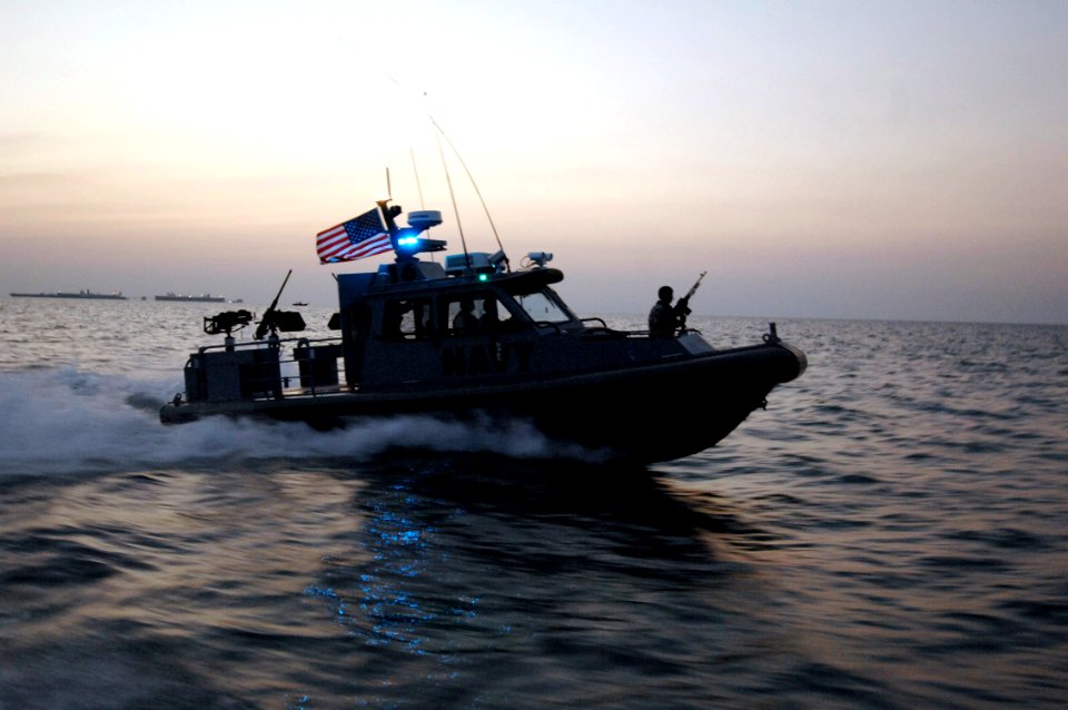 US Navy 061124-N-3642E-006 A rigid hull inflatable boat (RHIB) provides an escort for the Secretary of the Navy (SECNAV) The Honorable Dr. Donald C. Winter