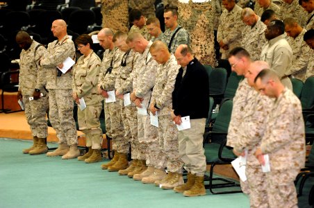 US Navy 061123-N-3642E-001 Secretary of the Navy (SECNAV) The Honorable Dr. Donald C. Winter takes a moment in prayer with U.S. Marines and Sailors stationed at Camp Fallujah
