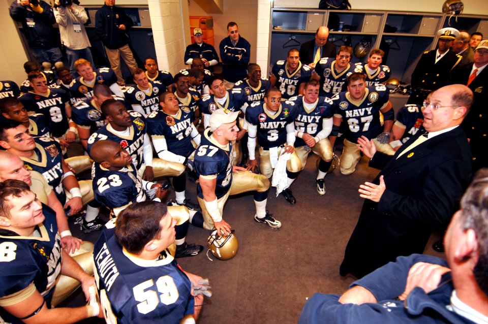 US Navy 061202-N-3642E-520 Secretary of the Navy (SECNAV) the Honorable Dr. Donald C. Winter, congratulates the Naval Academy football team after they defeated the Black Knights of the U.S Military Academy 26-14