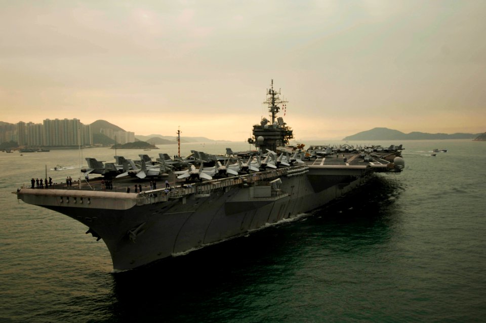 US Navy 061123-N-8591H-098 USS Kitty Hawk (CV 63) steams into Victoria Harbor for a port visit to Hong Kong after completing Annual Exercise 2006