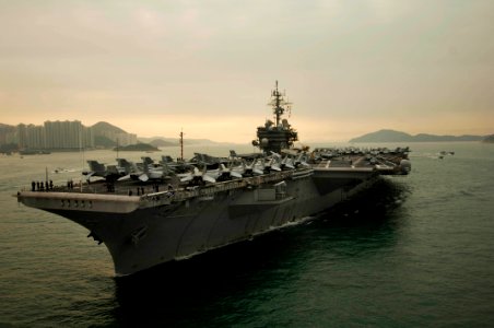 US Navy 061123-N-8591H-098 USS Kitty Hawk (CV 63) steams into Victoria Harbor for a port visit to Hong Kong after completing Annual Exercise 2006