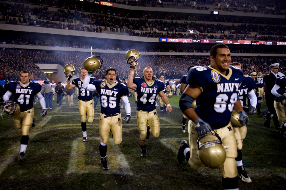 US Navy 061202-N-5319A-053 The U.S. Naval Midshipmen football team celebrates after winning the 2006 Army Navy Game