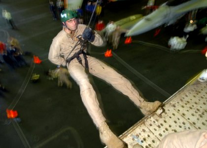 US Navy 061127-N-8907D-005 Navy Diver 1st Class John Doran with Explosive Ordnance Disposal Mobile Unit 6 (EODMU-6), Detachment 16, conducts repel and insertion training photo