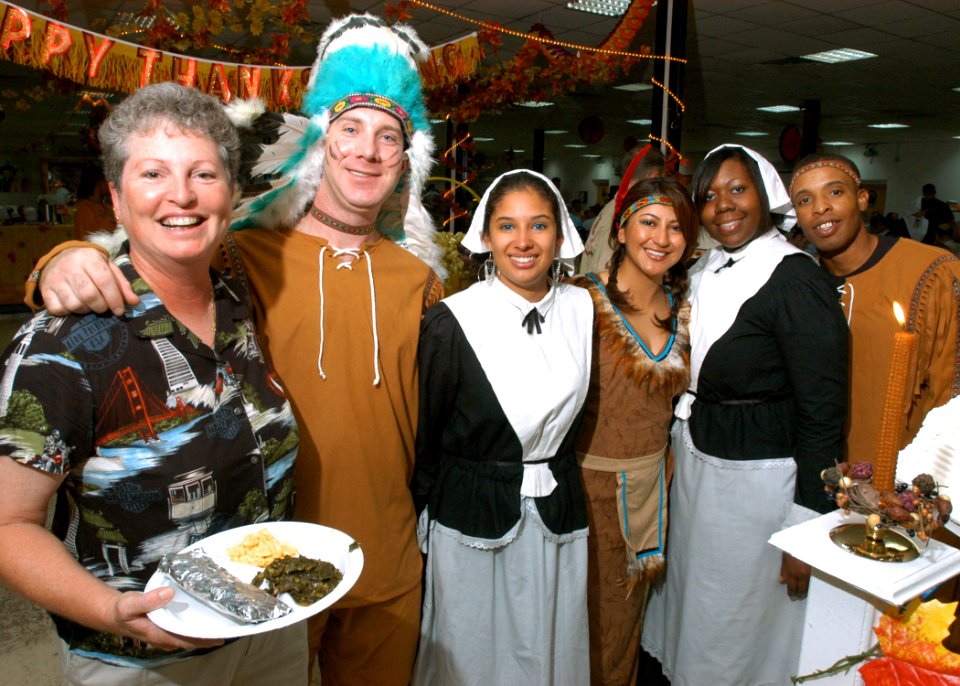 US Navy 061123-N-1328C-075 Command Master Chief Theresa Carroll (left) assigned to the Combined Joint Task Force-Horn of Africa takes time for pictures with the staff of the Bob Hope Dining Facility