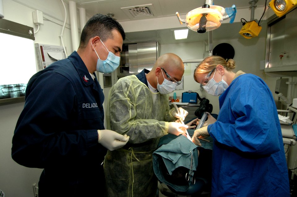 US Navy 061201-N-0209M-002 The multipurpose amphibious assault ship USS Boxer (LHD 4) dental staff performs dental surgery