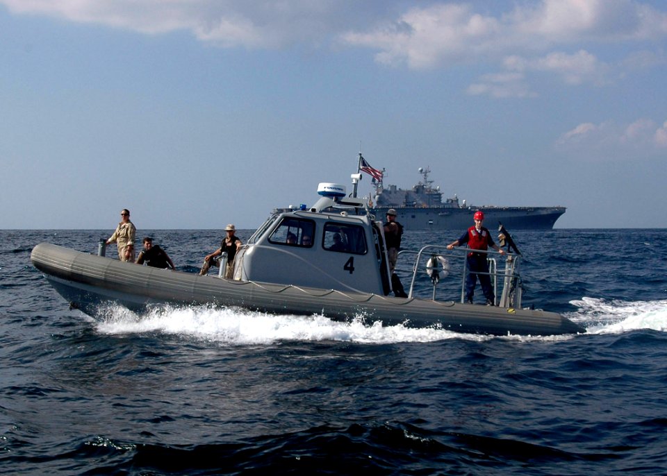US Navy 061121-N-8547M-067 An 11 meter Rigid Hull Inflatable Boat (RHIB) conducts Visit, Board, Search and Seizure (VBSS) training off the starboard side of amphibious assault ship USS Saipan (LHA 2)
