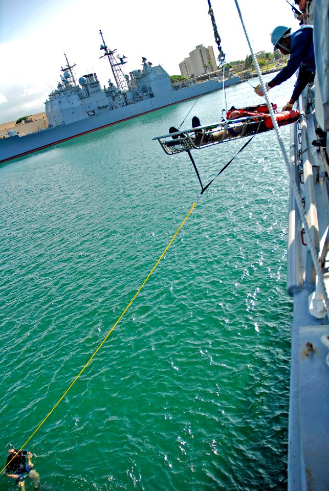 US Navy 061201-N-4774B-157 Sailors assigned to the Arleigh Burke-class guided-missile destroyer USS Russell (DDG 59) participate in a Search and Rescue (SAR) Limited Team Training exercise utilizing a medevac litter