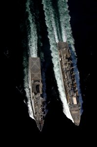 US Navy 061122-N-8148A-174 The Military Sealift Command (MSC) fast combat support ship USNS Supply (T-AOE 6), left, conducts an underway replenishment (UNREP) with the dock landing ship USS Comstock (LSD 45)