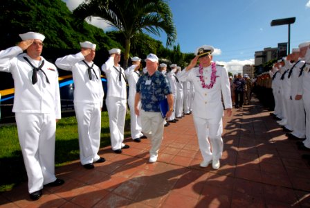US Navy 061205-N-4965F-004 USS Arizona survivor, retired Lt. Cmdr. Joseph Langdell returns a salute as he makes his way through an honor cordon for USS Arizona survivors