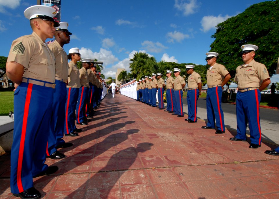 US Navy 061205-N-4965F-002 A chaplain assigned to Commander, Navy Region Hawaii checks the ranks of an honor cordon for USS Arizona survivors before an official welcome to the USS Arizona Memorial Visitors Center