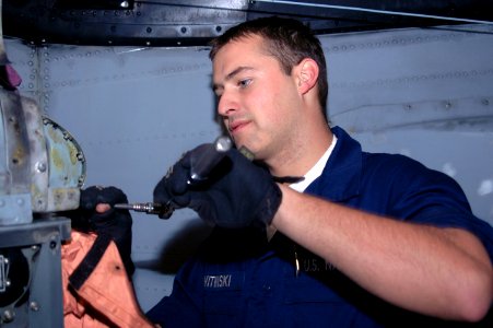 US Navy 061128-N-1226D-007 Avionics Technician Airman Blake Witwiski, assigned to Helicopter Anti-submarine Squadron Light Four Five (HSL-45), works on a magnetic anomaly detector on an SH-60 Seahawk