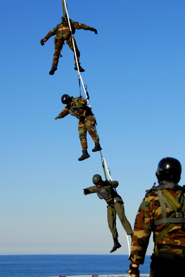 US Navy 061205-N-8158F-354 Sailors assigned to Explosive Ordnance Disposal Mobile Unit One One (EODMU-11), Detachment Northwest, participate in special purpose insertion and extraction (SPIE) exercise