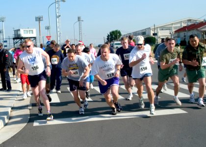 US Navy 061201-N-8534H-009 Sailors, Marines and family members start running the Yokosuka Morale, Recreation and Welfare 5k Toys for Tots Run outside the Commander Fleet Activities Yokosuka new gymnasium photo