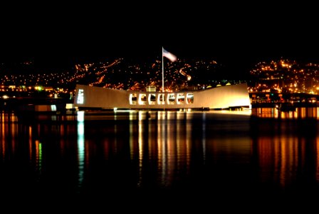 US Navy 061206-N-4965F-001 The city lights of Aiea, Hawaii, is the backdrop forUSS Arizona Memorial the morning prior to the joint U.S. Navy-National Park Service ceremony commemorating the 65th Anniversary of the attack on Pea