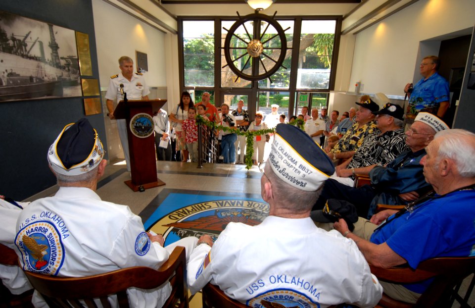 US Navy 061206-N-4965F-010 Capt. Frank J. Camelio, commander of Pearl Harbor Naval Shipyard and Intermediate Maintenance Facility, delivers his remarks to USS Oklahoma survivors