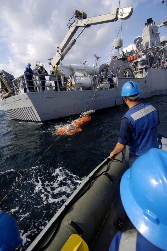 US Navy 061202-N-5555T-019 U.S. Navy Sailors with the mine countermeasures ship USS Ardent (MCM 12) test the motor to a mine neutralization vehicle (MNV) in the Arabian Sea prior to conducting a mine countermeasure exercise