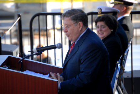 US Navy 061206-N-9195K-031 Former New Hampshire governor and White House Chief of Staff John H. Sununu delivers a speech during the christening ceremony for the newest Lewis and Clark class ship