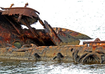 US Navy 061203-N-4774B-015 The rusted hull of the USS Utah remains in the water just off Ford Island. Three aerial torpedoes struck the USS Utah, causing the ship to sink during the 1941 attack