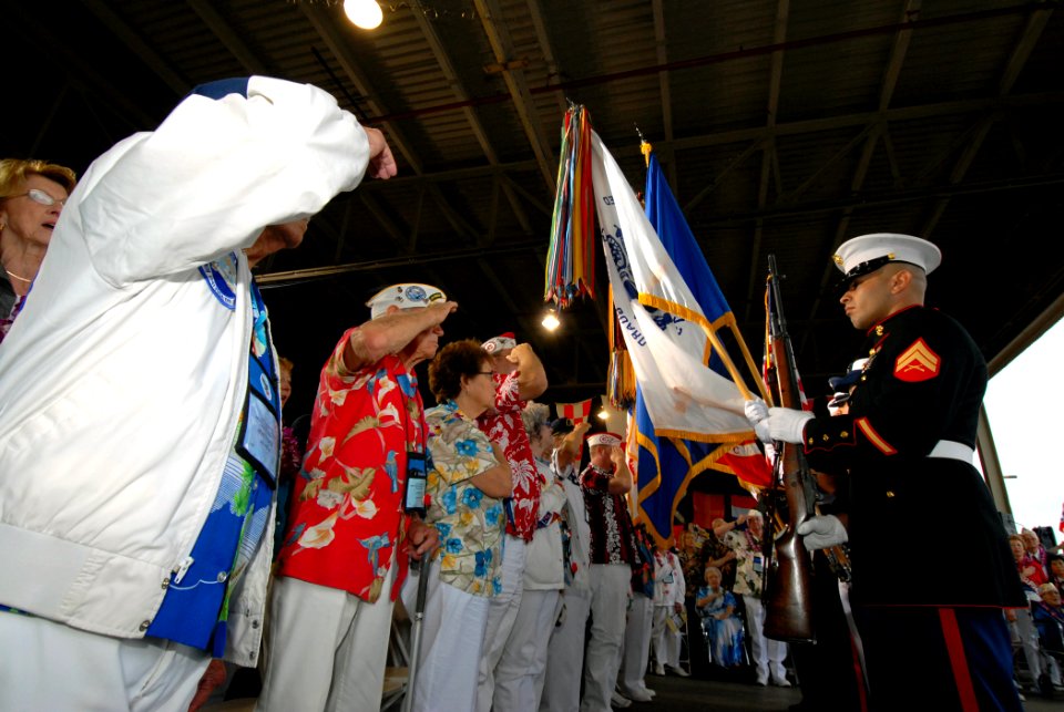 US Navy 061207-N-4965F-014 Pearl Harbor survivors render honors during a joint U.S. Navy-National Park Service ceremony commemorating the 65th Anniversary of the attack on Pearl Harbor