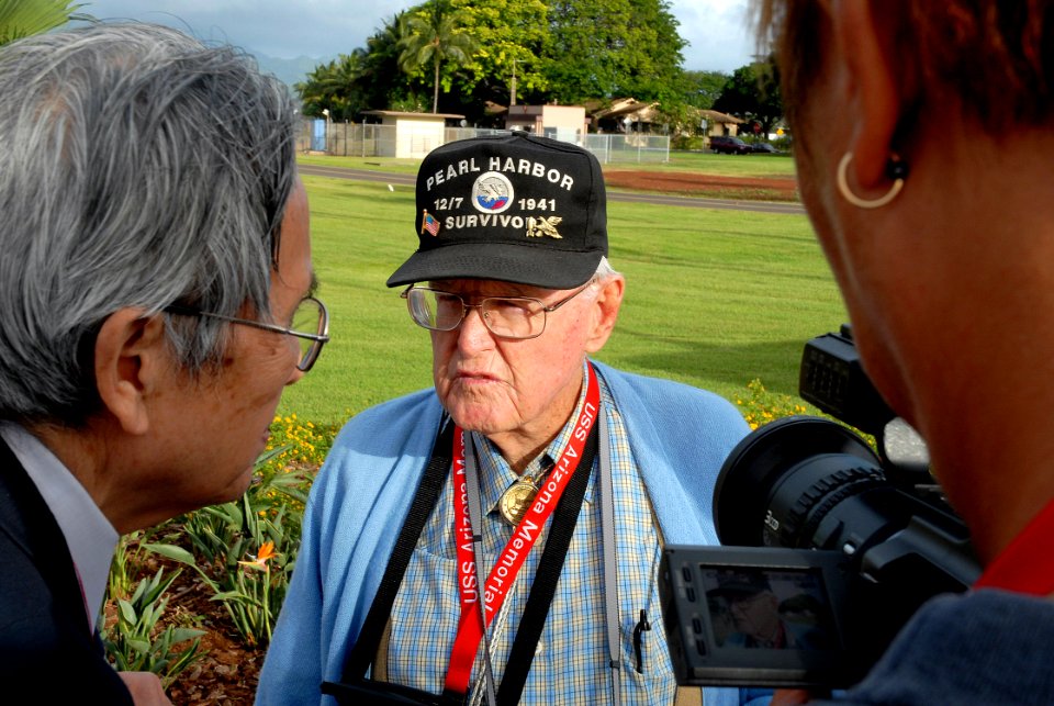 US Navy 061203-N-4774B-017 William Bob Johnson, Pearl Harbor Survivor, answer questions for Japanese news agency Asahi Broadcasting on Ford Island, at the location Johnson was the day of the 1941 attack on Pearl Harbor