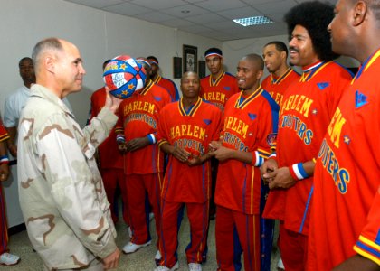 US Navy 061208-N-1328C-253 Combined Joint Task Force-Horn of Africa Commander, Rear Adm. Richard Hunt, meets with the Harlem Globetrotters, prior to their performance at Camp Lemonier, home of the Combined Joint Task Force-Horn photo