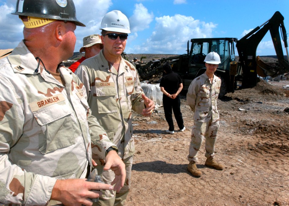 US Navy 061209-N-1328C-397 Commander, U.S. Naval Facilities Engineering Command Rear Adm. Richard E. Cellon speaks with Construction Electrician 1st Class Damien Brandlen, leading petty officer for the Tadjoura Primary school p