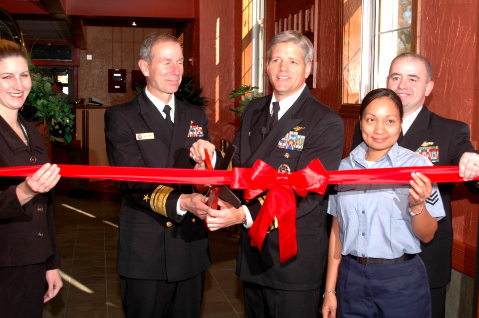 US Navy 061205-N-5307M-349 Naval Station Norfolk Commanding Officer, Capt. Loyd Pyle, and Commander, Navy region Mid-Atlantic, Rear Adm. Rick Ruehe, cut the ribbon at the grand opening ceremony
