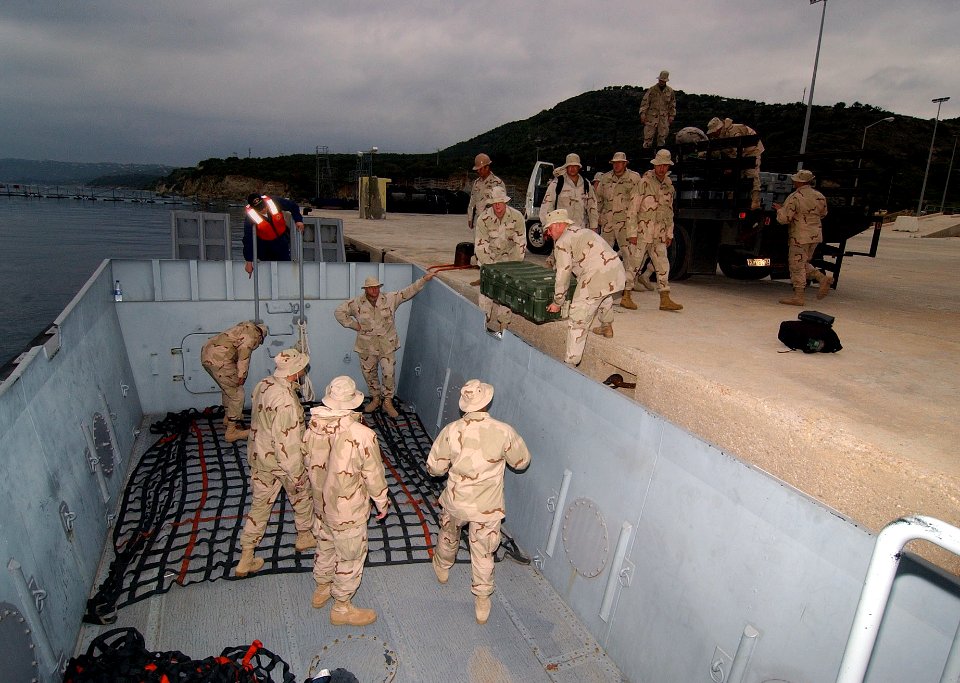 US Navy 061203-N-0780F-001 Sailors of Mobile Security Detachment 32 load their equipment into a 50-foot workboat for embark on board Military Sealift Command (MSC) roll-on-roll-off ship USNS Soderman (T-AKR 317)