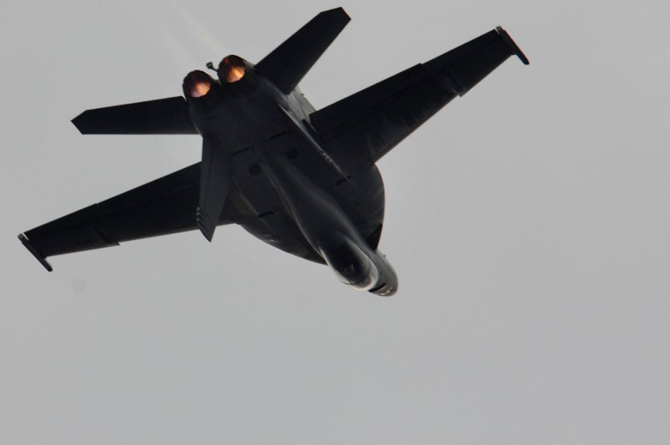 US Navy 061204-N-8591H-167 An F-A-18F Super Hornet assigned to the Strike Fighter Squadron One Zero Two (VFA-102) performs an aircraft roll as part of an air power demonstration aboard USS Kitty Hawk (CV 63)