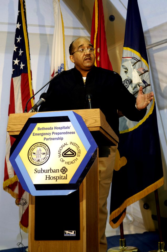 US Navy 061207-F-2090M-024 U.S. Navy Rear Adm. Adam M. Robinson, Jr., commander of Navy Medicine National Capital Area Region, speaks during the collaborative multi-agency exercise (CMAX) press conference
