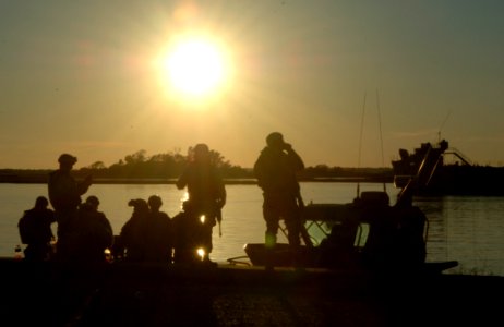 US Navy 061205-N-4097B-020 As the sun sets, Sailors assigned to Riverine Squadron One (RIVRON-1) prepare for their final exercise and evaluations near Camp Lejeune, N.C