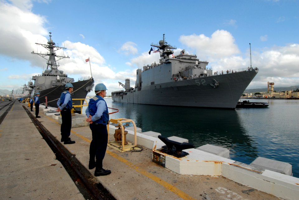 US Navy 061204-N-4965F-007 Gas Turbine System Technician Electrical 3rd Class Adam Payne, Gunner's Mate 3rd Class Jared Nichols and other Sailors assigned to Arleigh-Burke class guided-missile destroyer USS Russell (DDG 59) wai